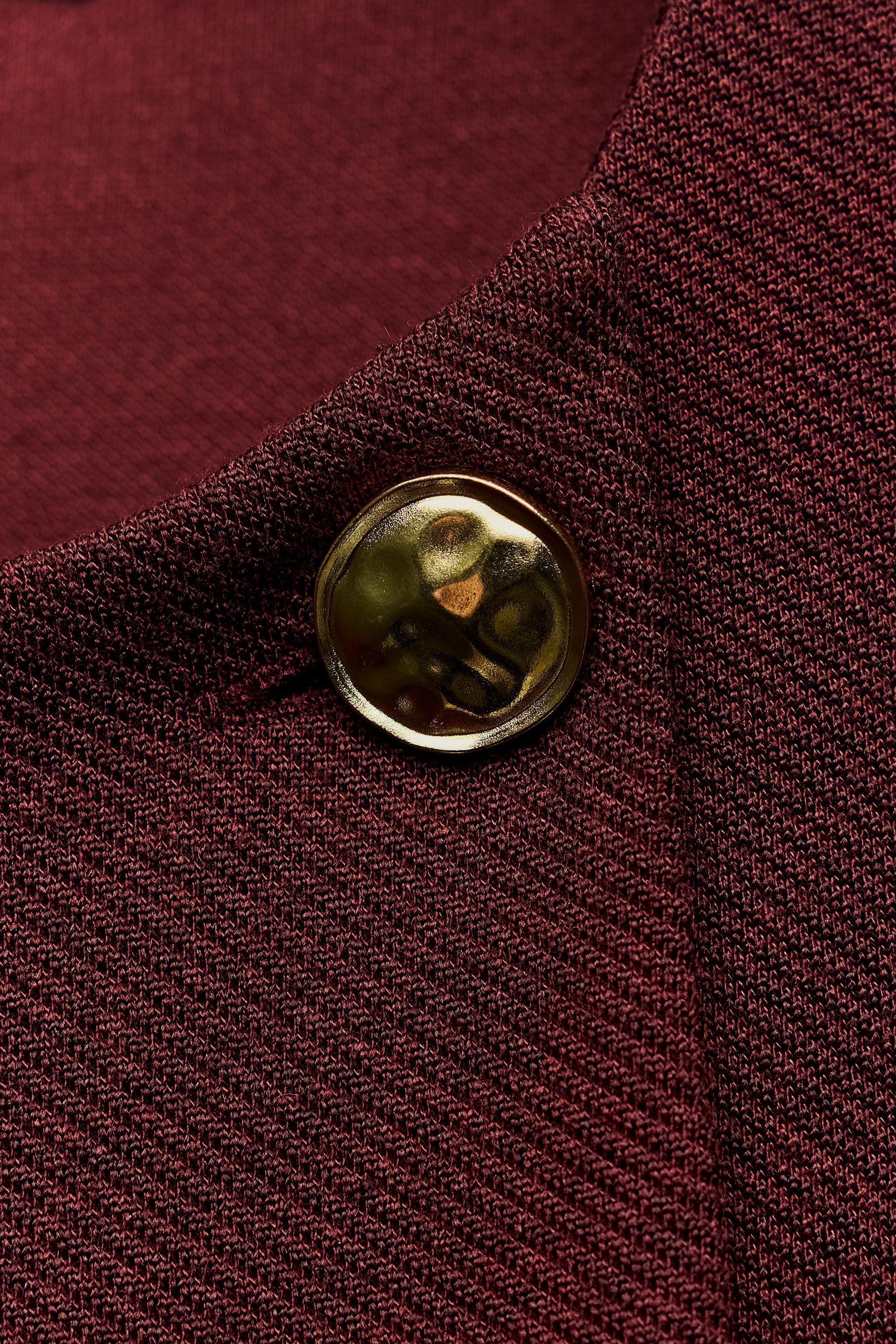 BUTTON CAPE Product Image