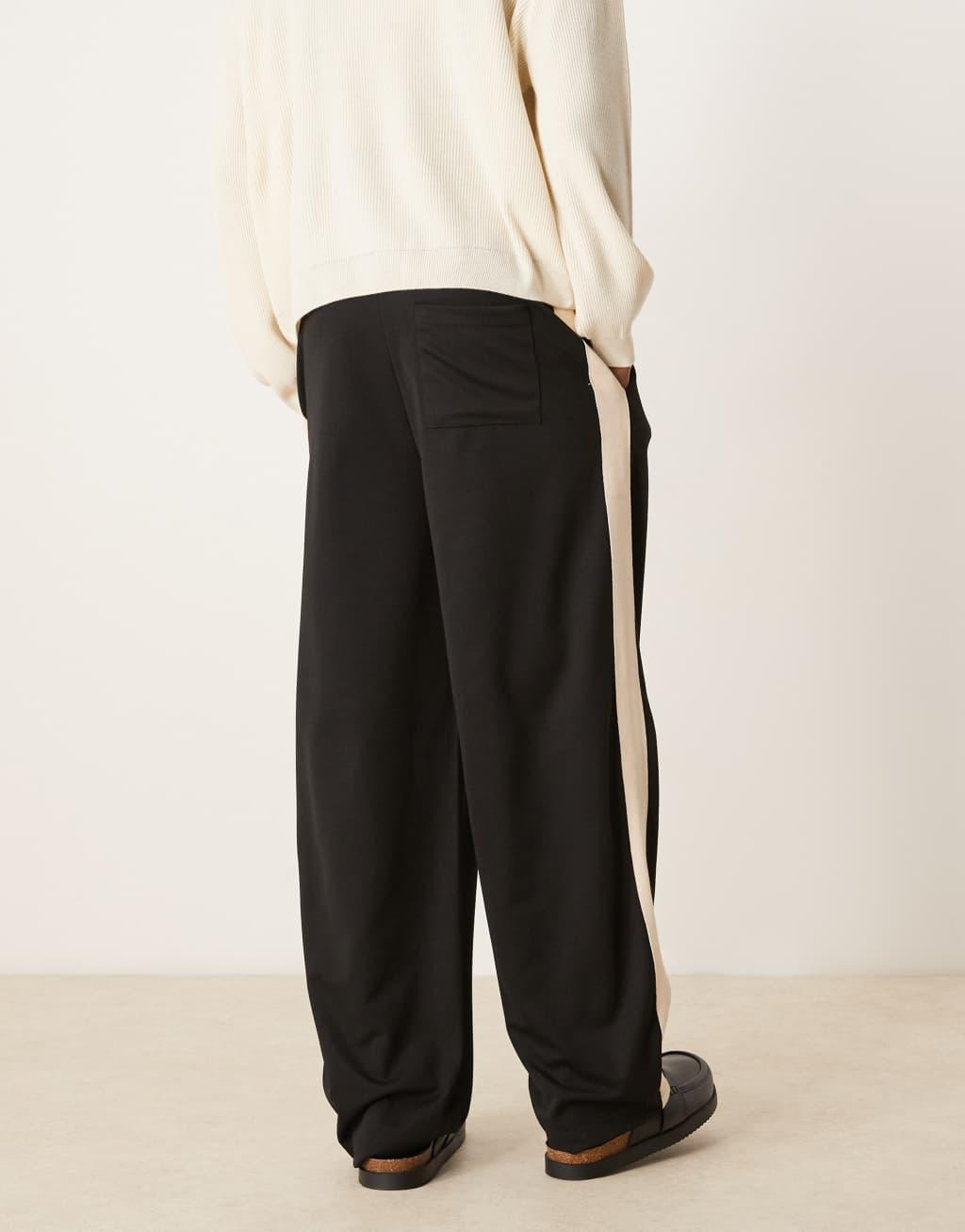 ASOS DESIGN super baggy sweatpants with taping in black Product Image