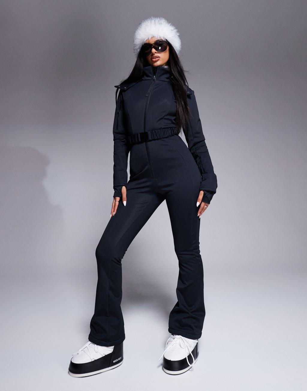 ASOS 4505 Ski belted ski suit with slim kick leg and faux fur hood in black Product Image