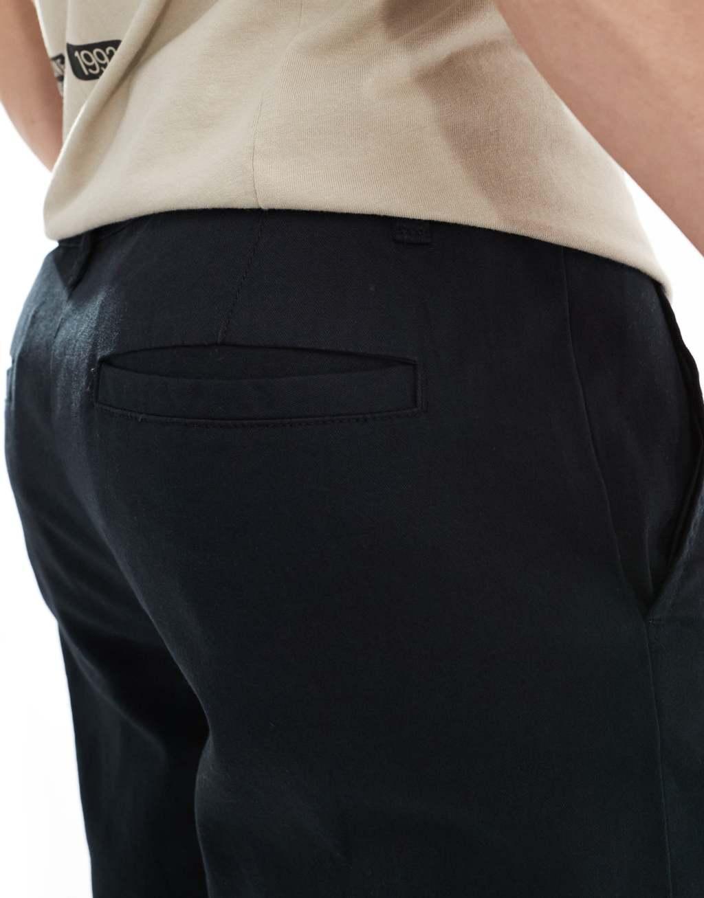 ASOS DESIGN tapered chinos in black Product Image