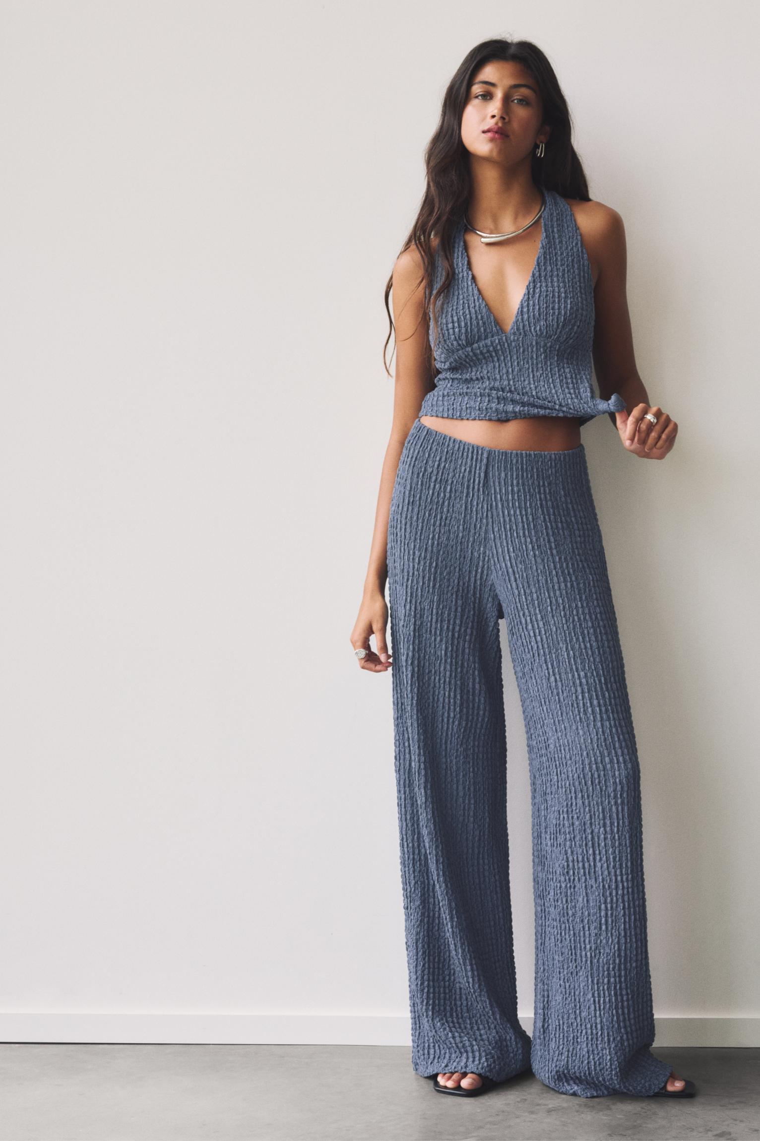 Rustic creased-effect pants Product Image