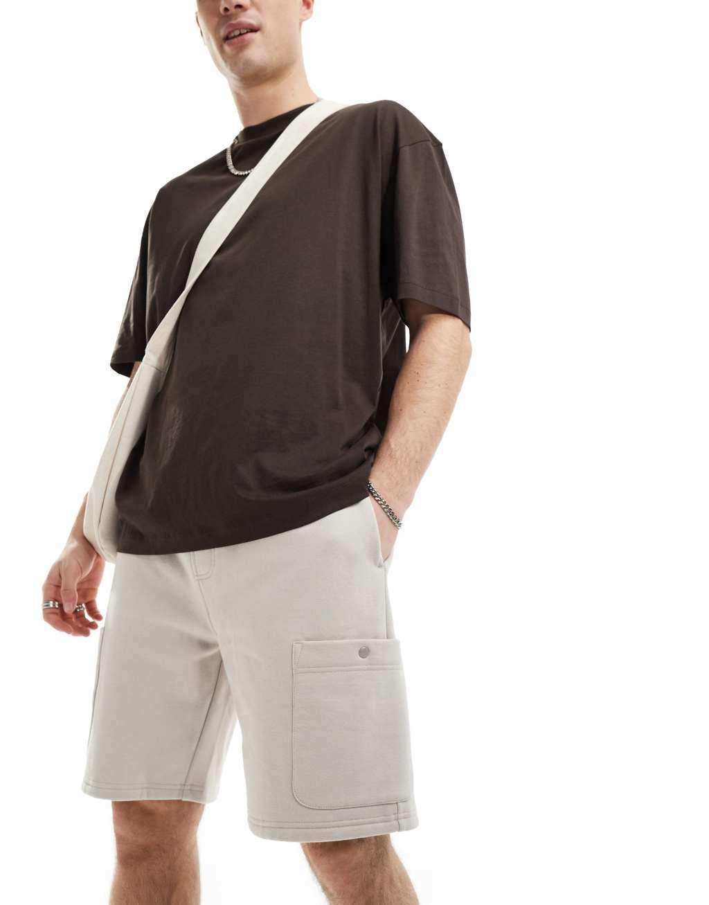 ASOS DESIGN heavyweight cargo shorts in beige Product Image