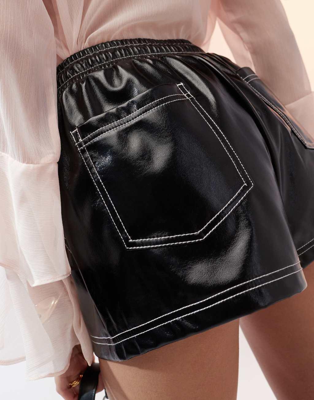 ASOS DESIGN contrast stitch vinyl shorts in black Product Image