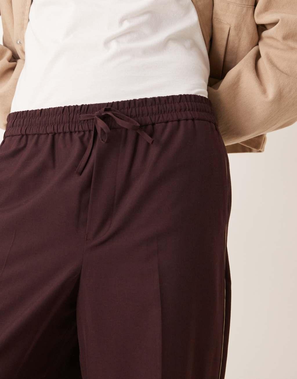 ASOS DESIGN pull on smart wide leg pants with side piping in burgundy Product Image