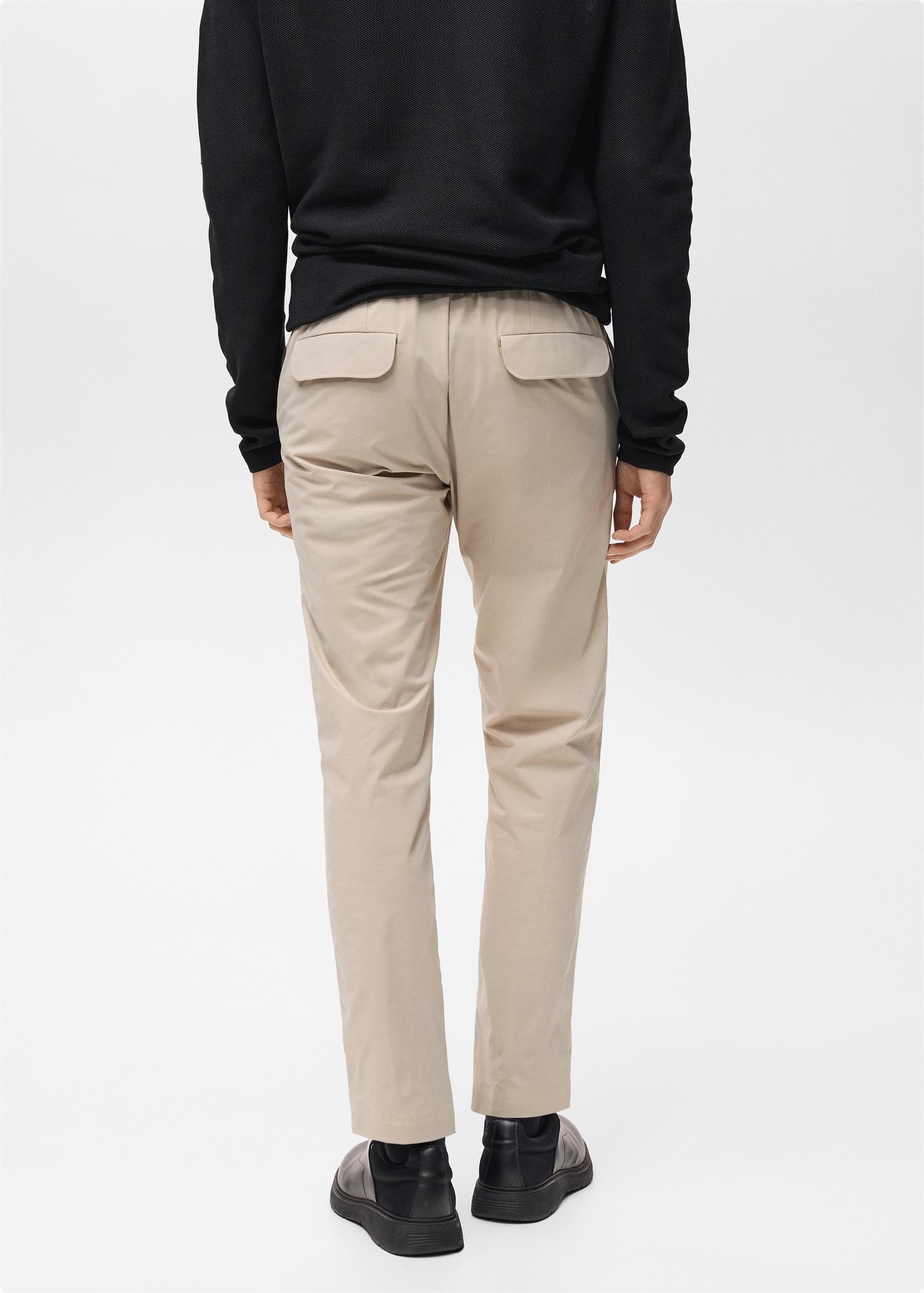 Stretch fabric slim-fit pants with drawstring - Men | MANGO USA Product Image