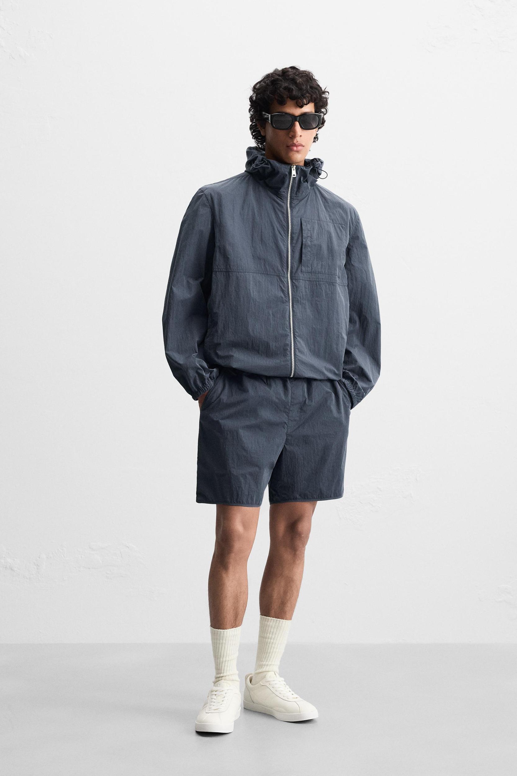 HOODED TECHNICAL JACKET Product Image