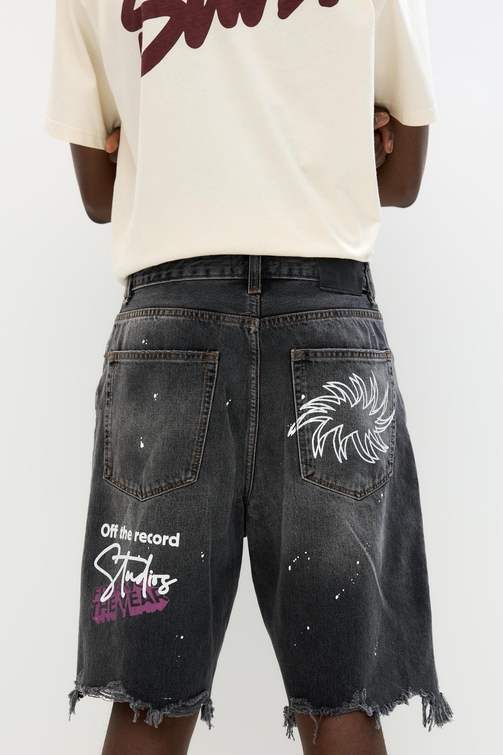 Ripped denim Bermuda shorts Product Image