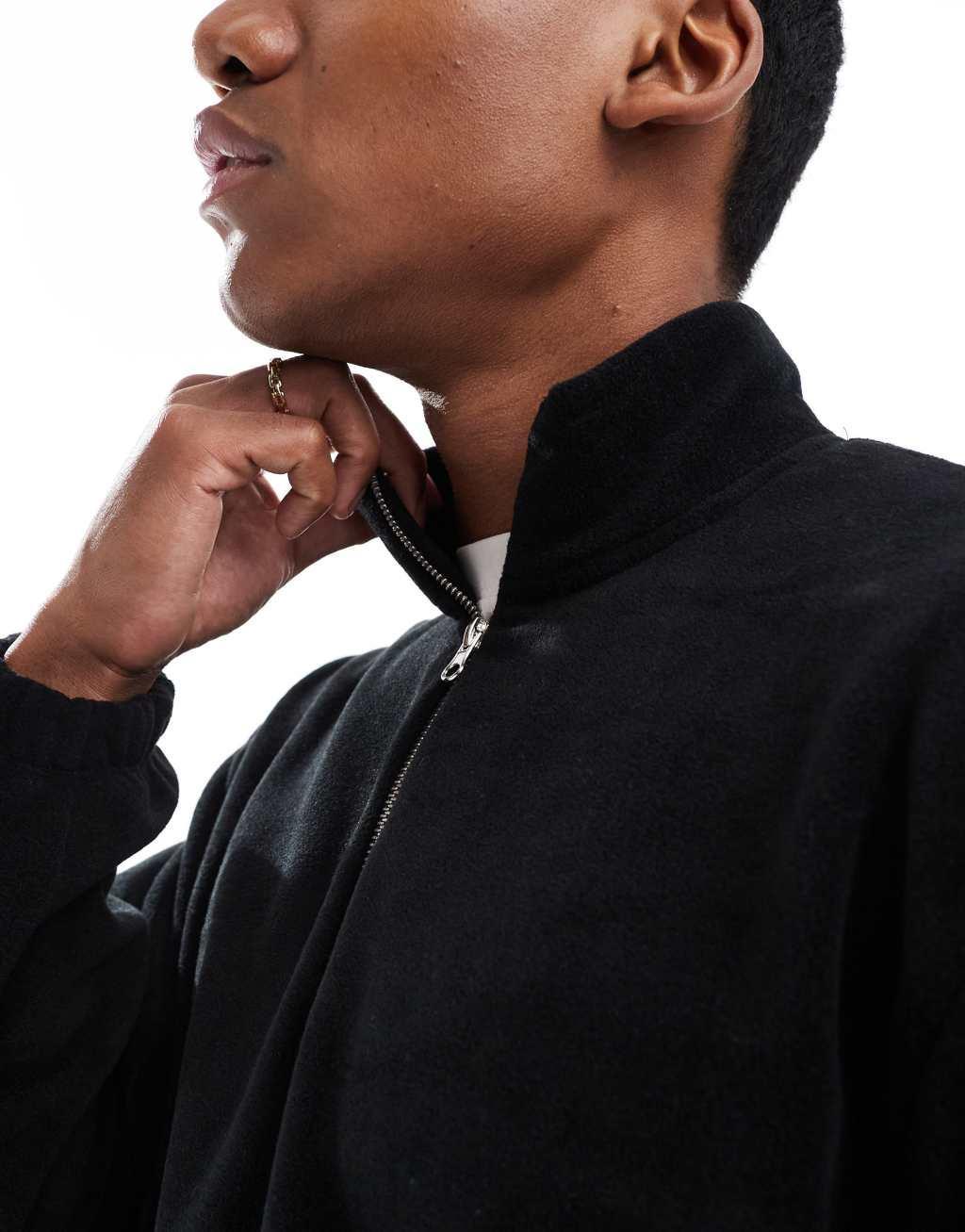 ASOS DESIGN boxy oversized fleece sweatshirt with quarter zip and elastic hem in black Product Image