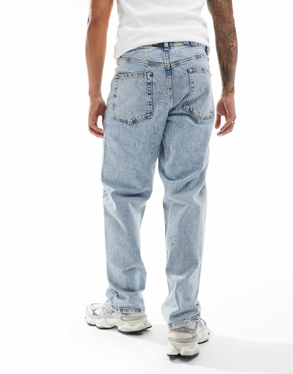 ASOS DESIGN baggy fit jeans with heavy acid wash in light wash blue   Product Image