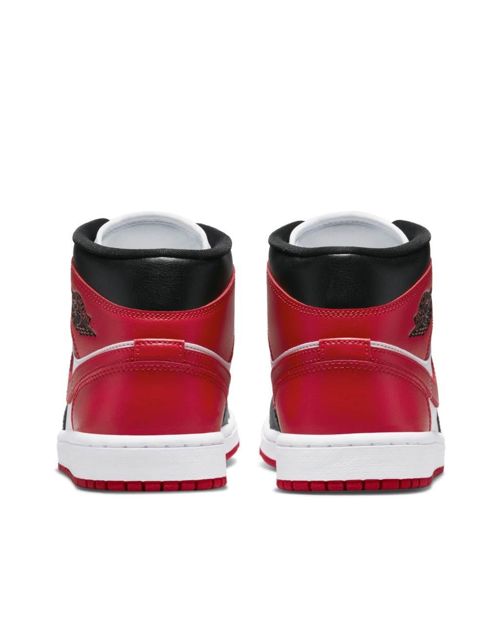 Nike Air Jordan 1 mid sneakers in black and red  Product Image