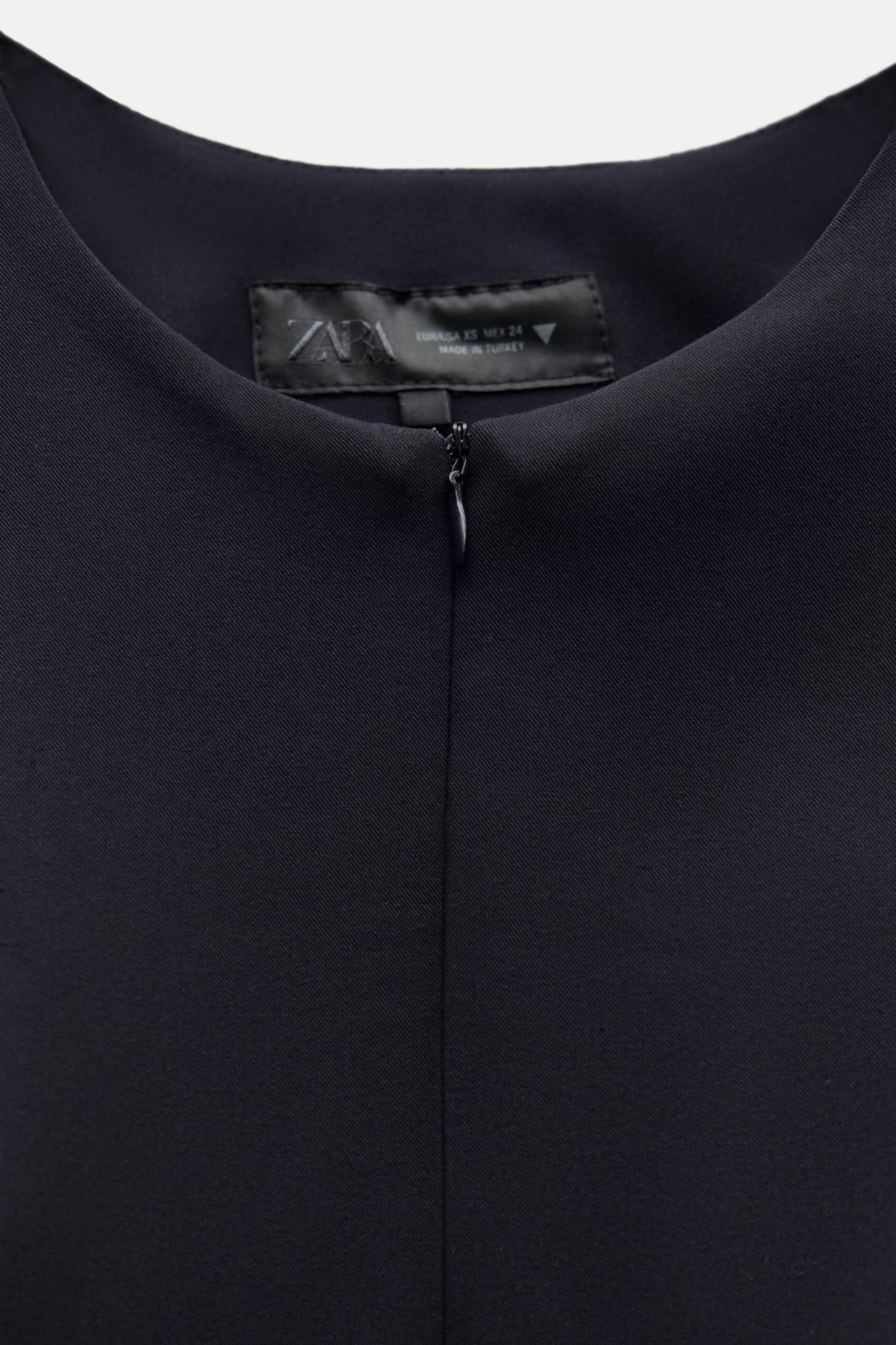 DART PEPLUM TOP Product Image