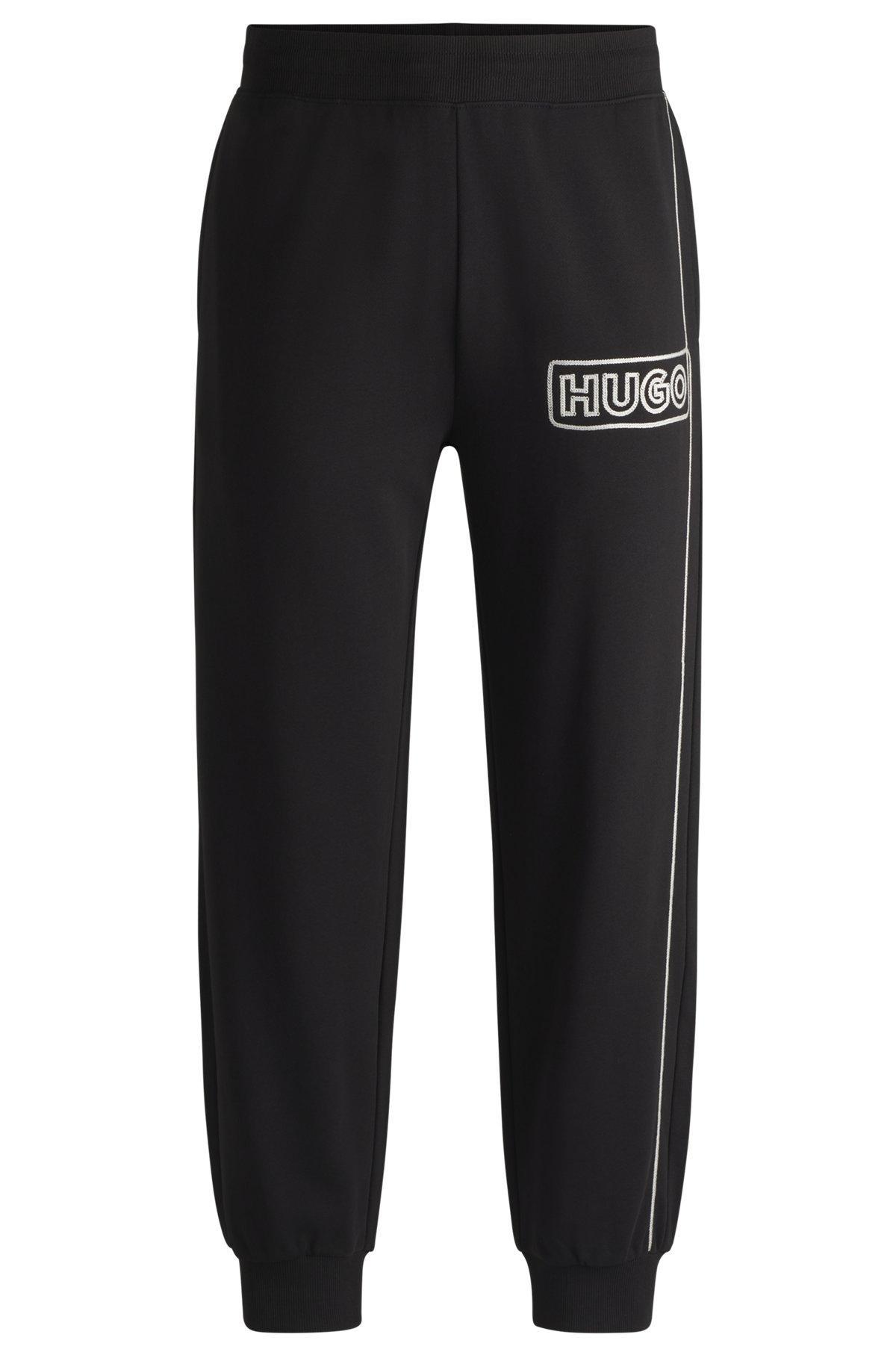 Cotton-terry tracksuit bottoms with chain-stitch logo Product Image