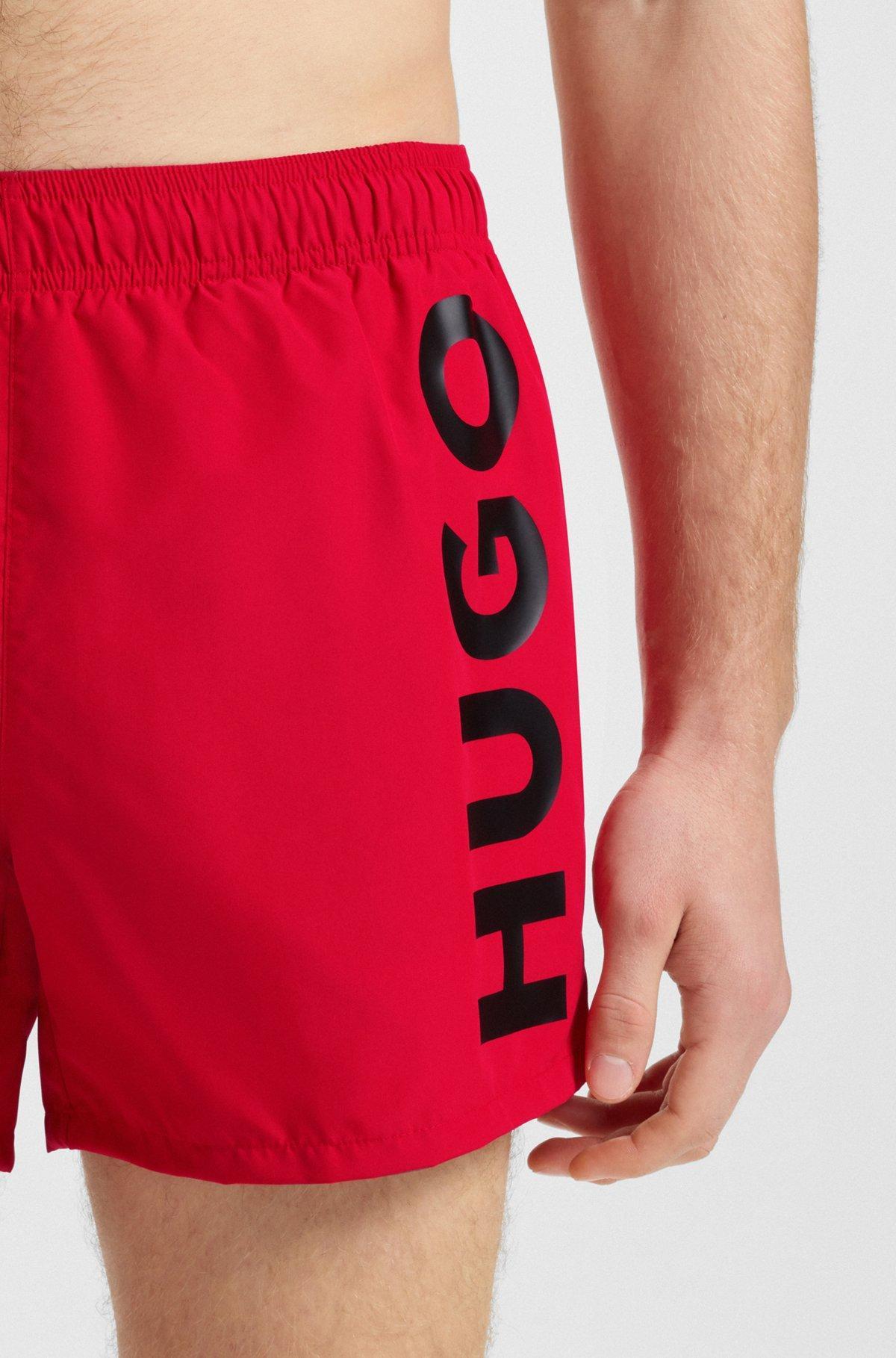 HUGO - Quick-dry swim shorts with vertical logo print - light pink Product Image
