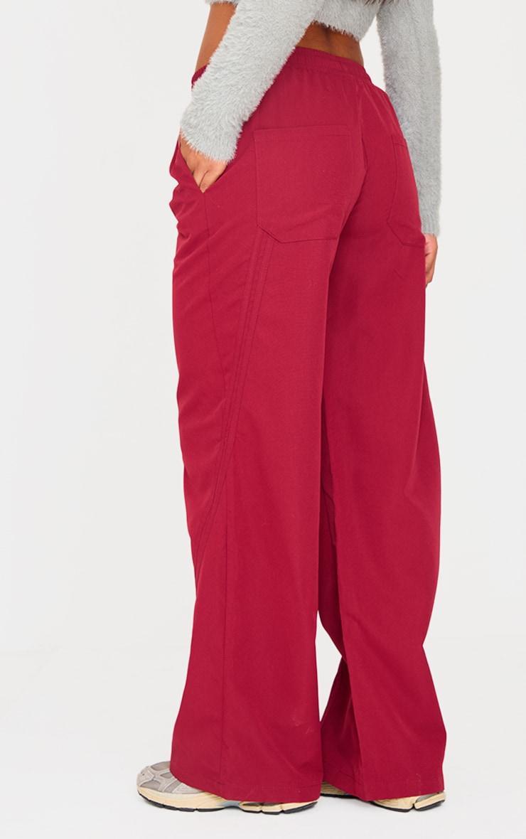 Burgundy Asymmetric Side Stripe Detail Track Pants Product Image