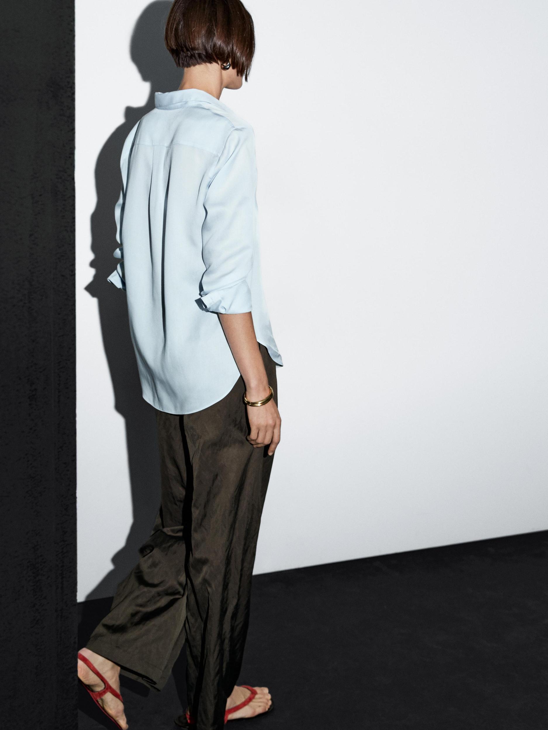 Wide-leg satin trousers with creased effect Product Image