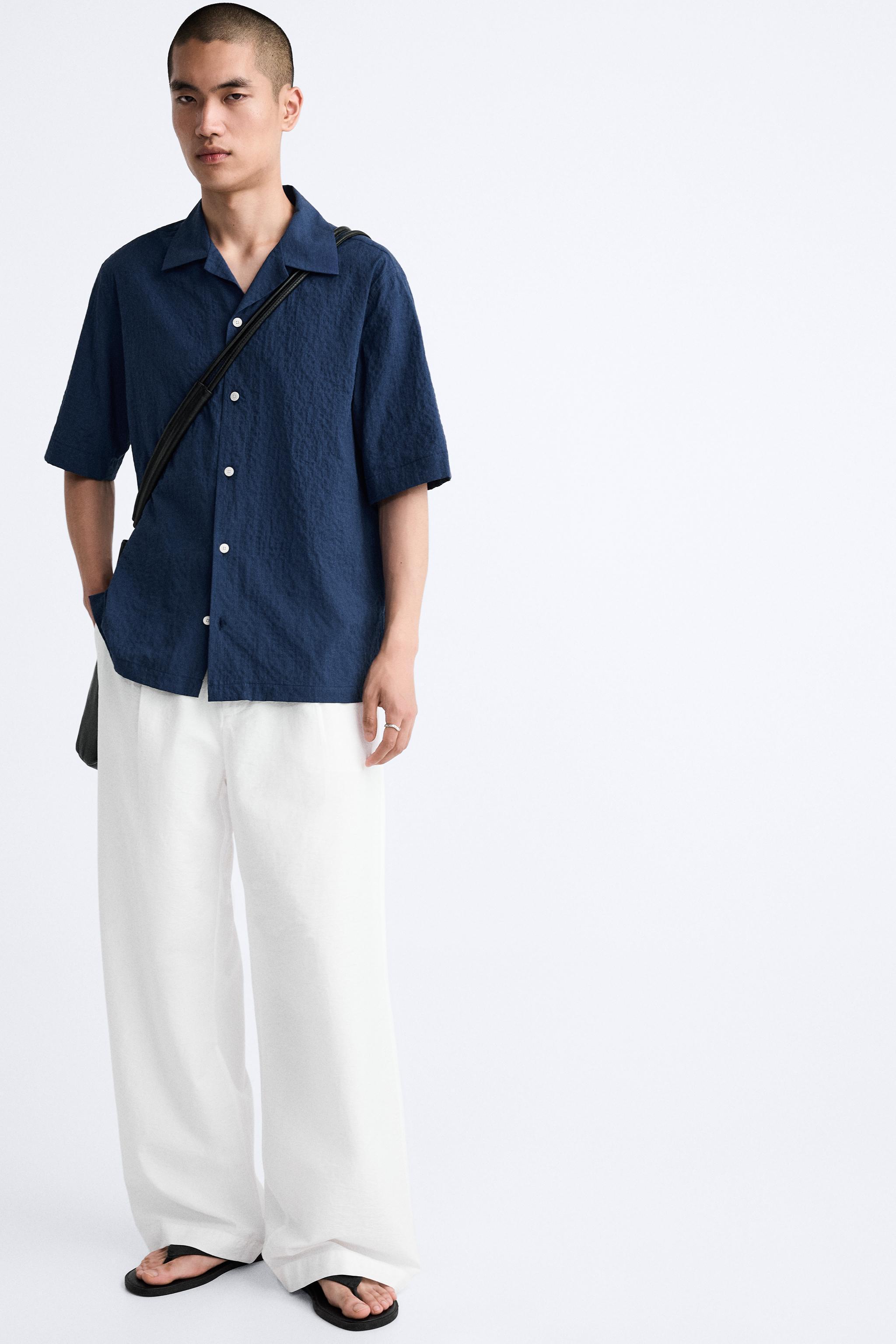 PLEATED WIDE FIT PANTS Product Image