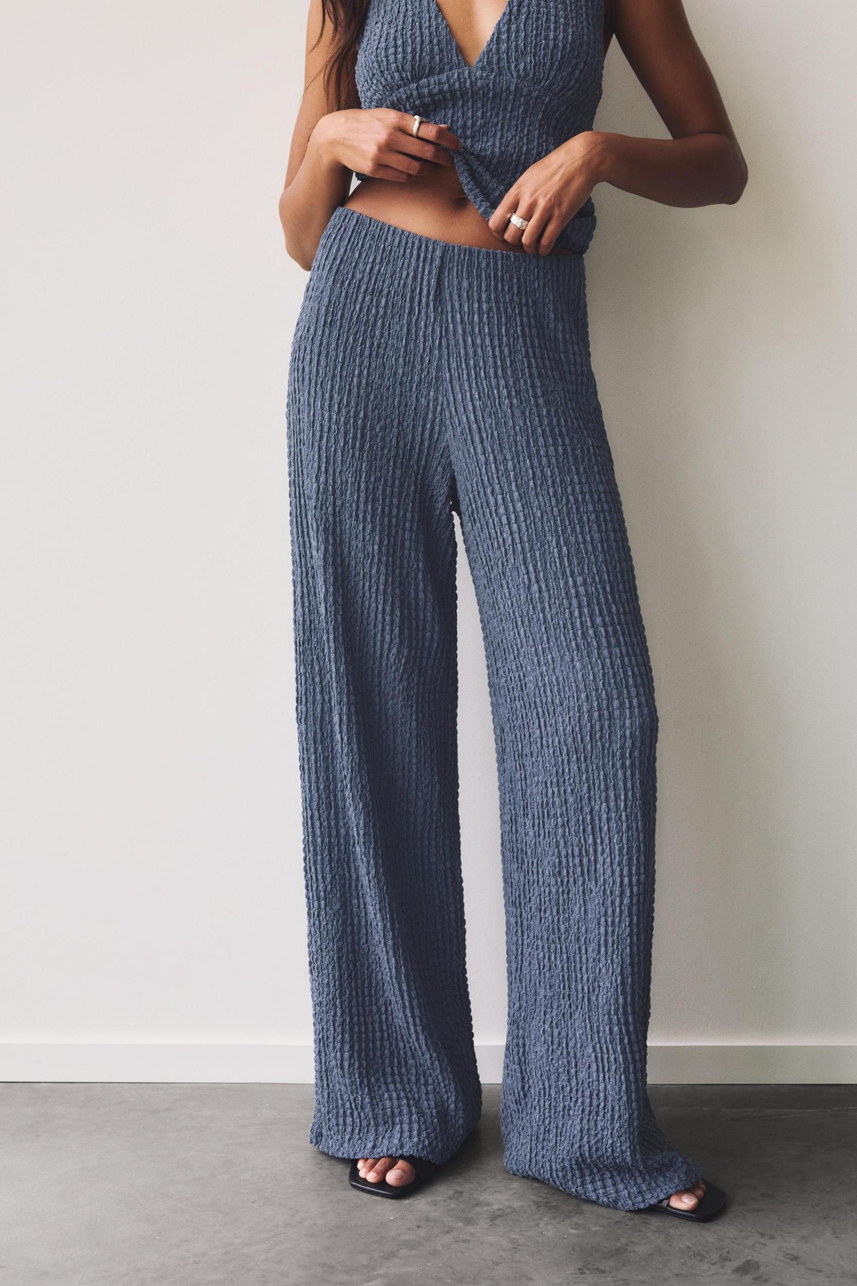 Rustic creased-effect pants Product Image