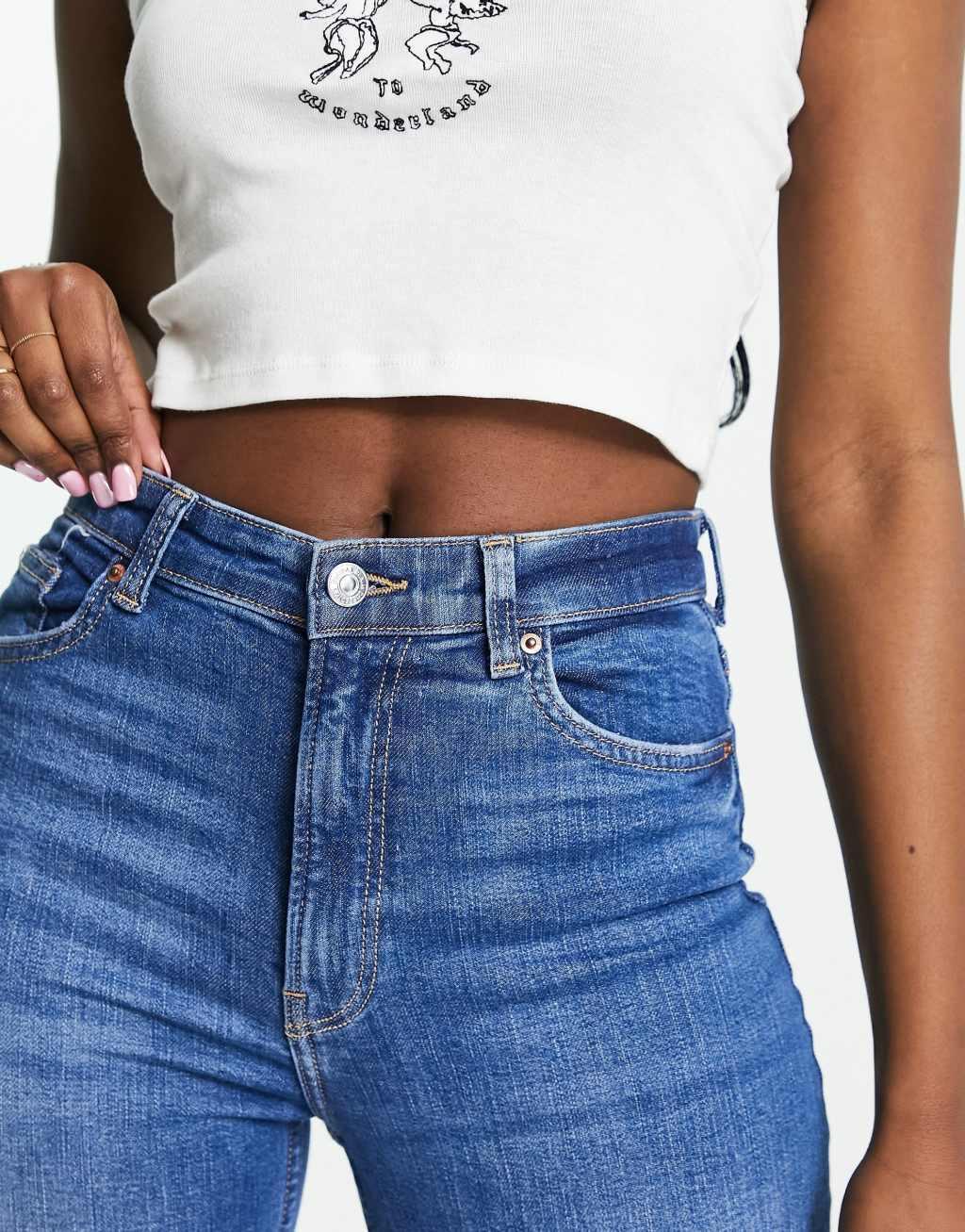 Bershka high rise flared jeans in mid blue Product Image