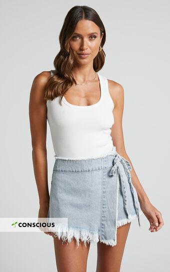 Ellyza Skort - Recycled Cotton Frayed Edge Wrap Denim Skort in Mid Blue Wash Product Image