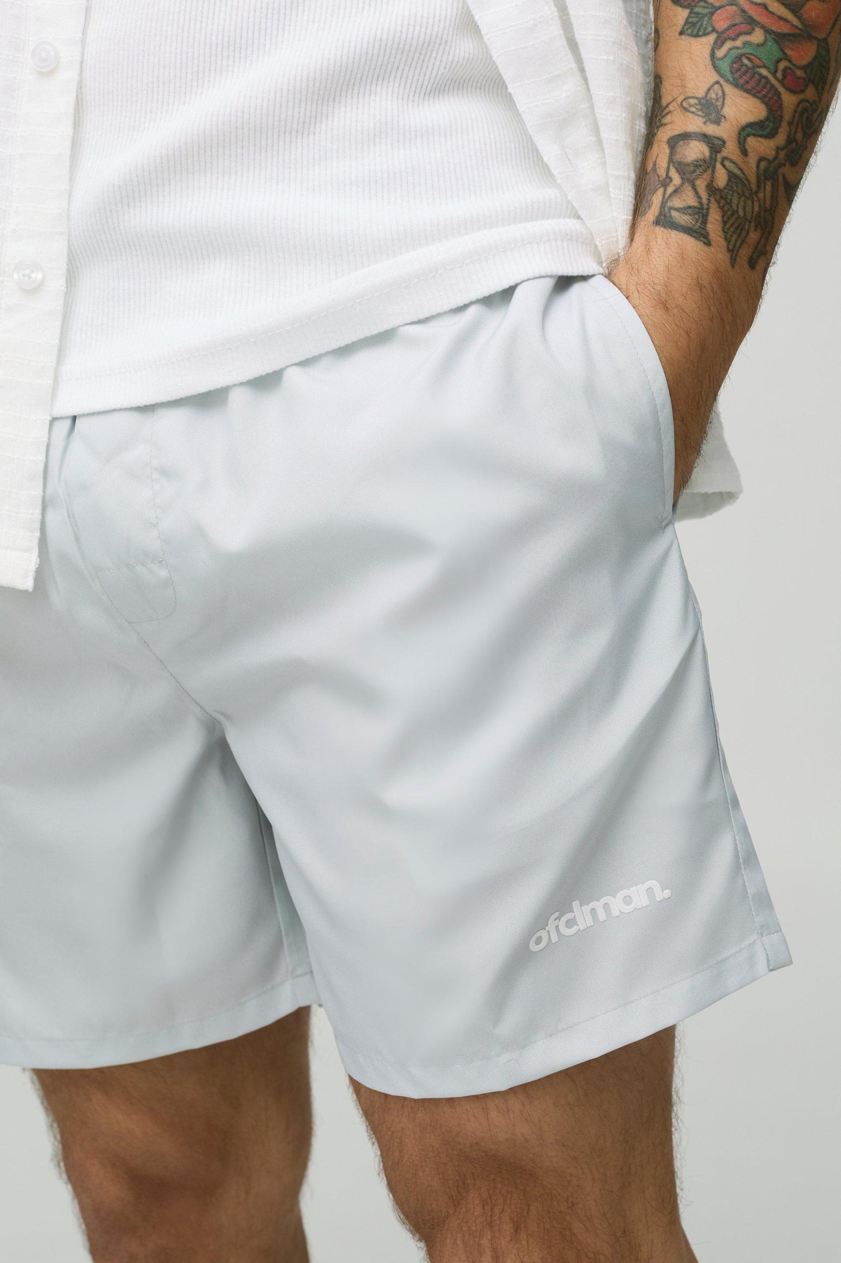 Mid Length Official Man Branded Swim Trunks | boohooMAN USA Product Image