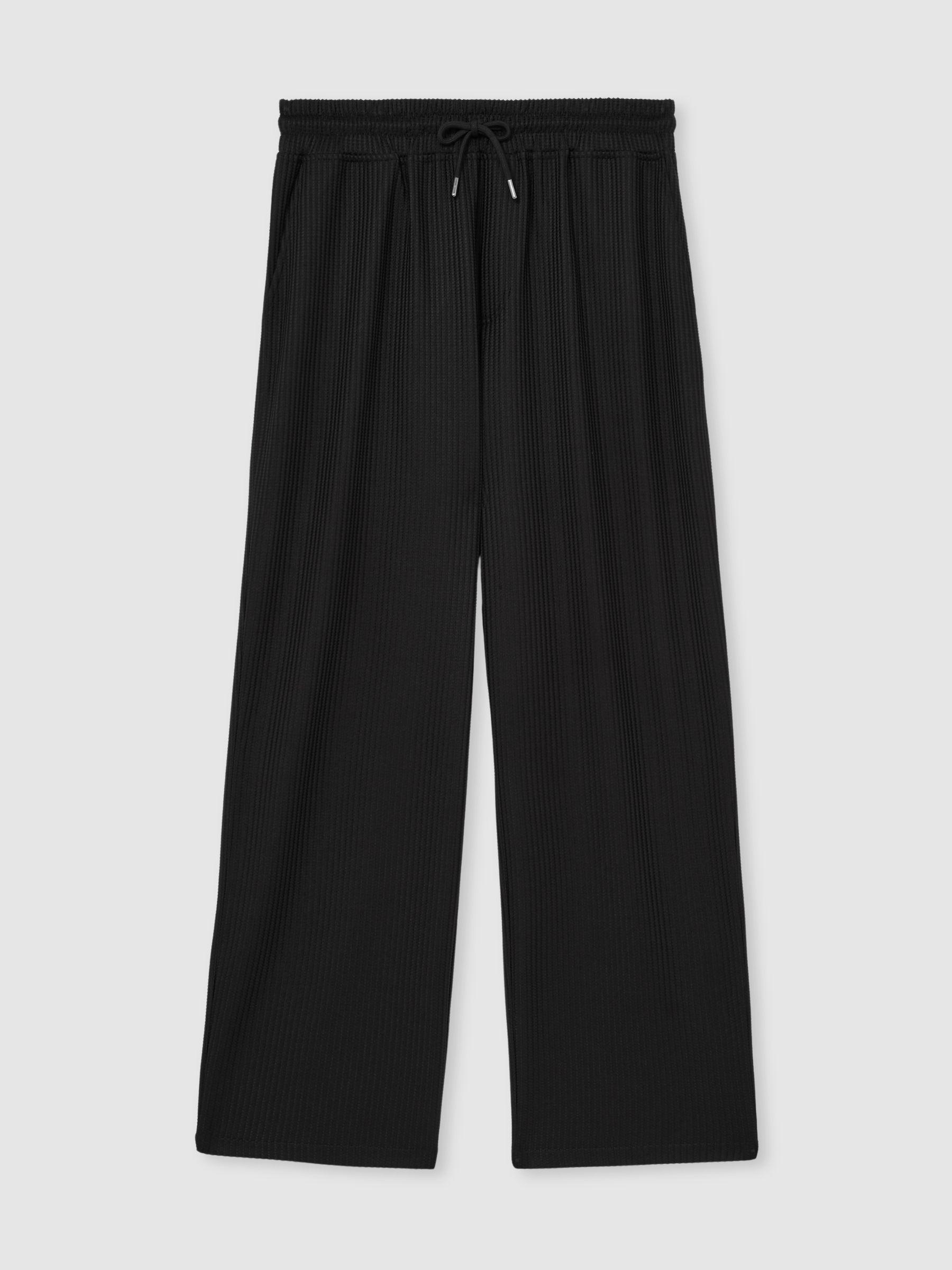 Textured-Knit Tapered Trousers in Black Product Image