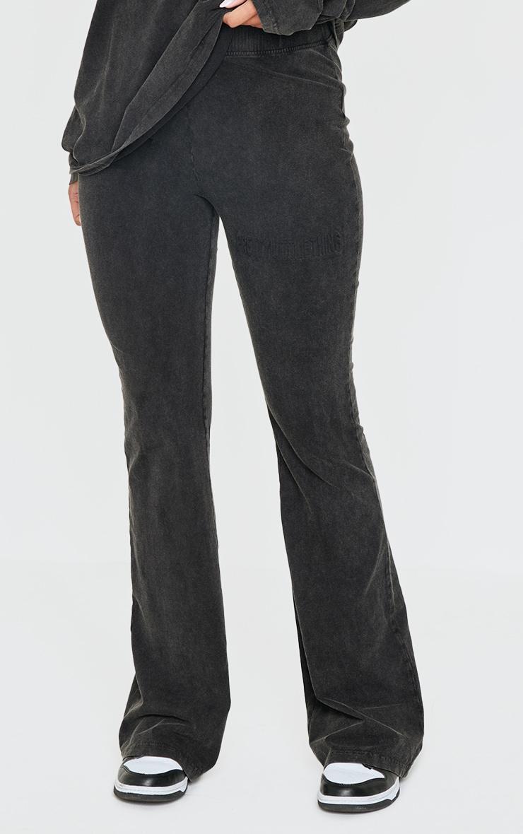 PRETTYLITTLETHING Black Embossed Logo Washed Skinny Flare Pants Product Image