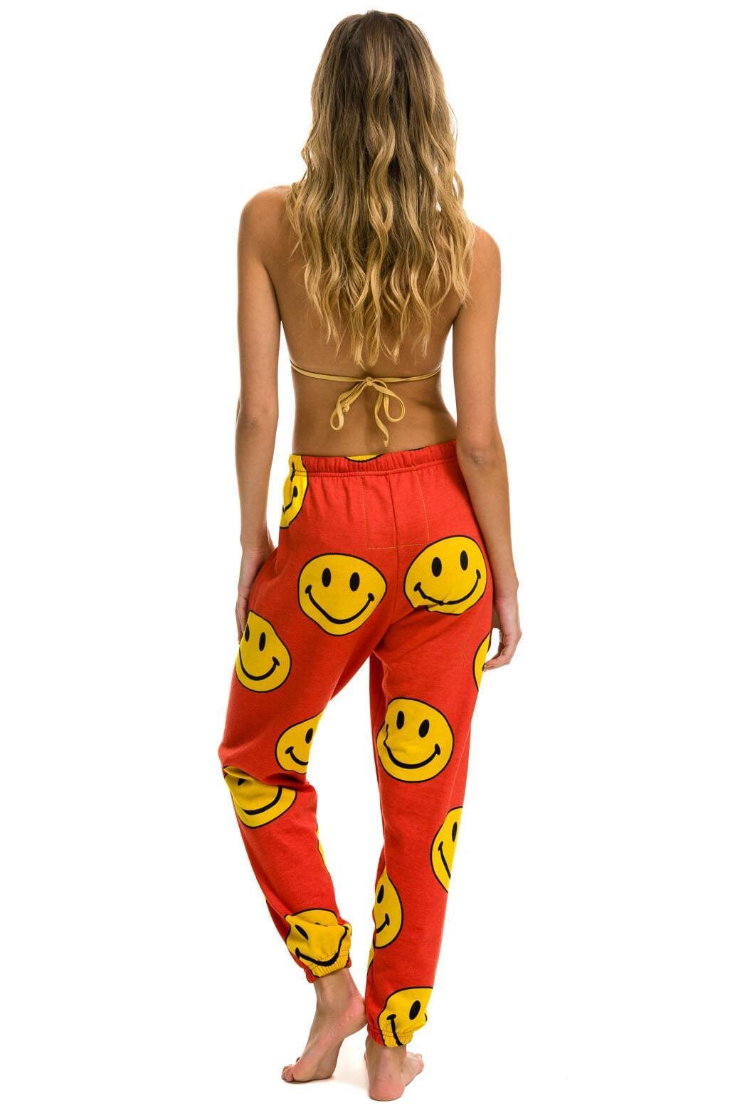 SMILEY REPEAT SWEATPANTS - RED Female Product Image