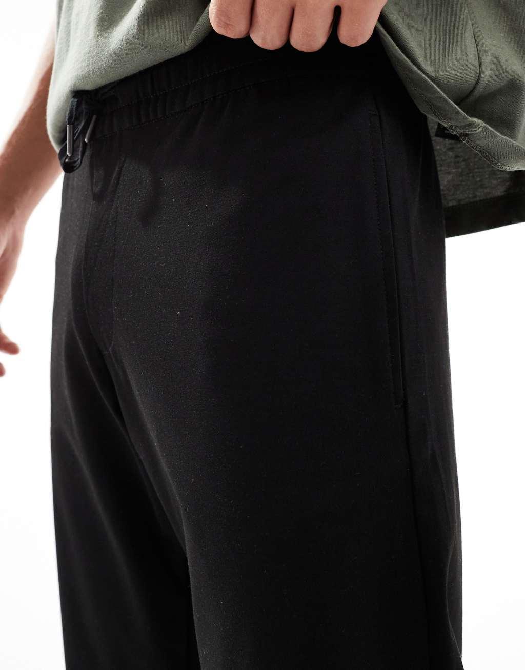 Jack & Jones drawstring tapered pants in black Product Image