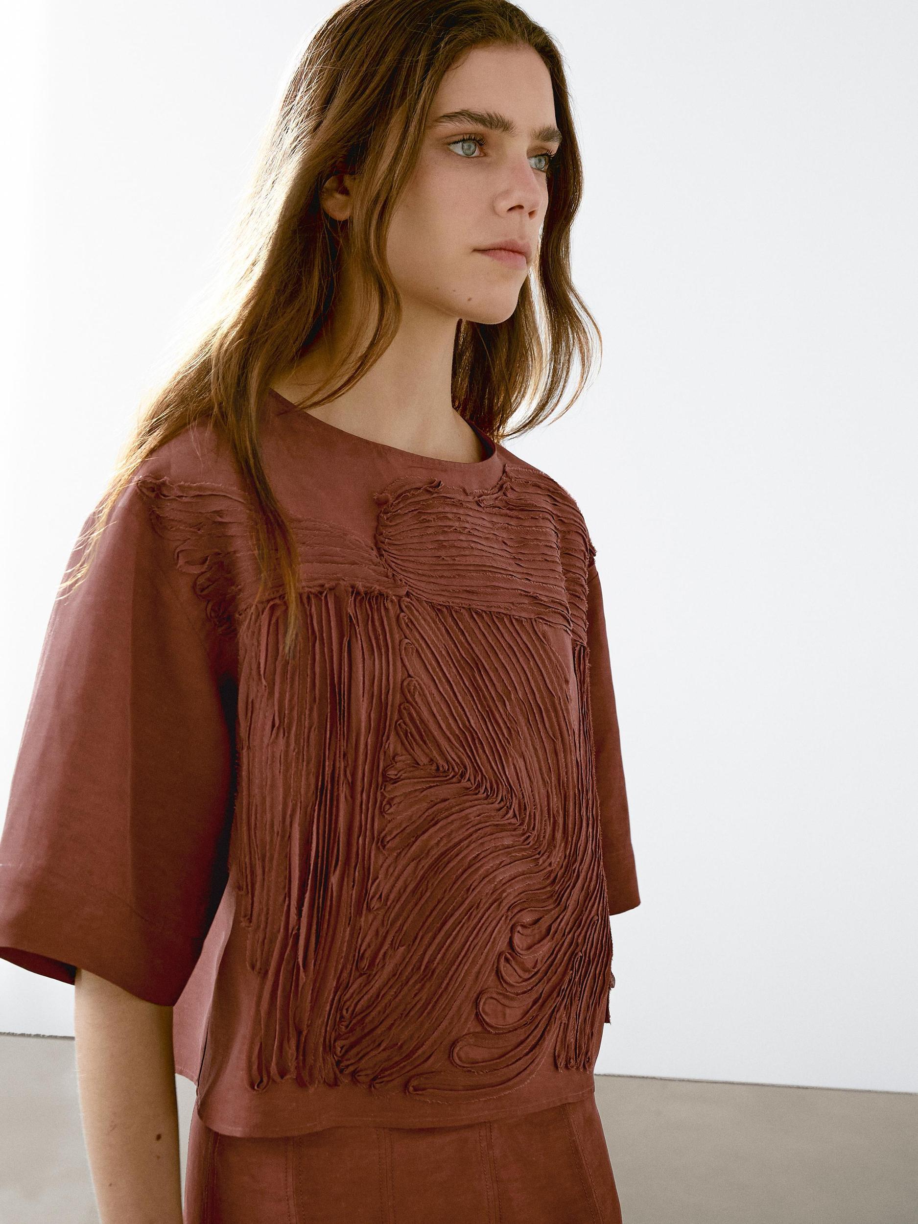 Flowing top with embroidered detail Product Image