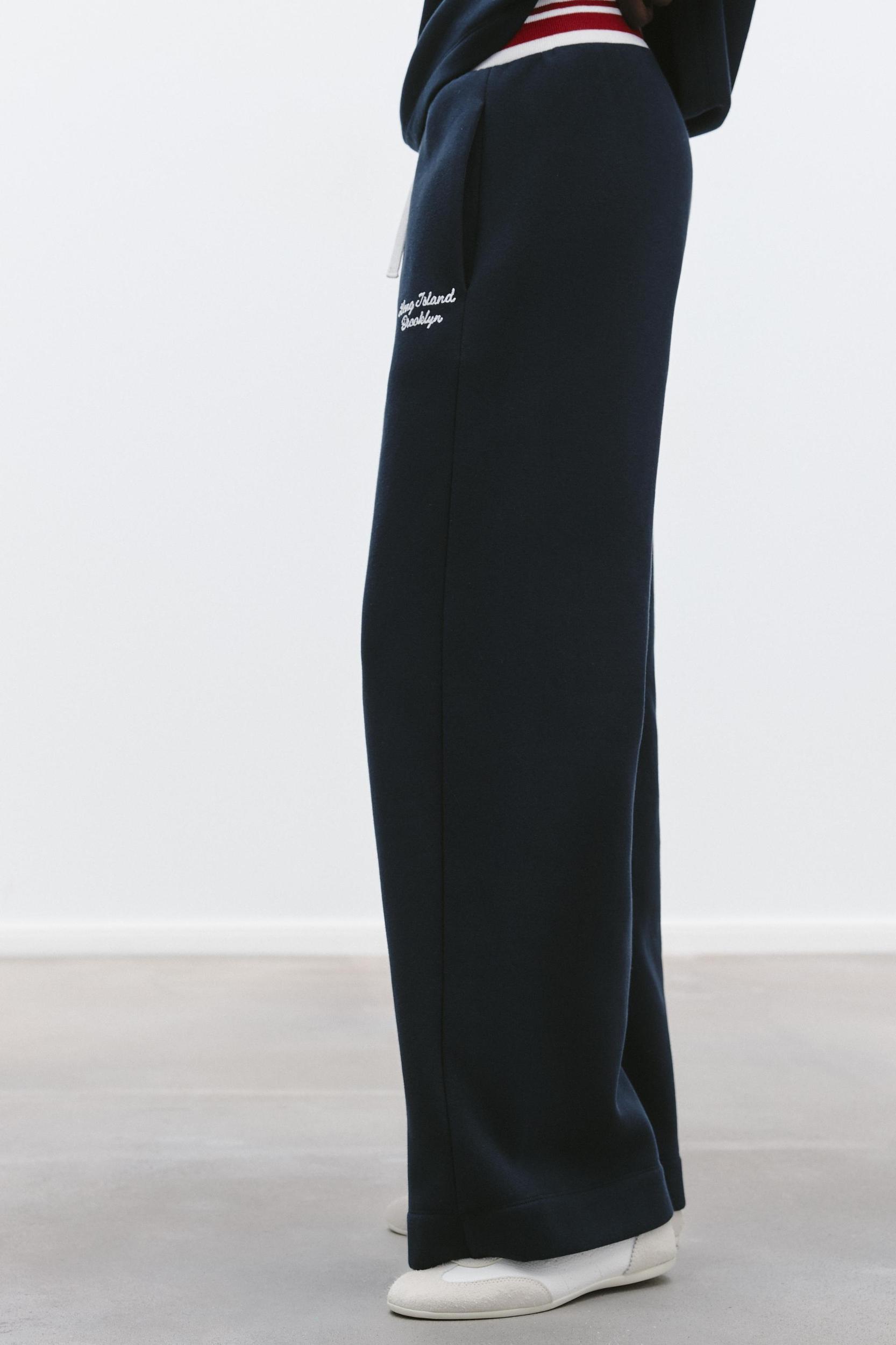 EMBROIDERED TEXT PANTS Product Image