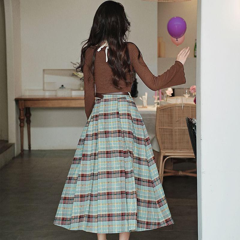 Set: Mock Two-Piece Long-Sleeve Halter Bow Button Crop Knit Top + High Rise Plaid Pleated Midi A-Line Skirt + Belt Product Image