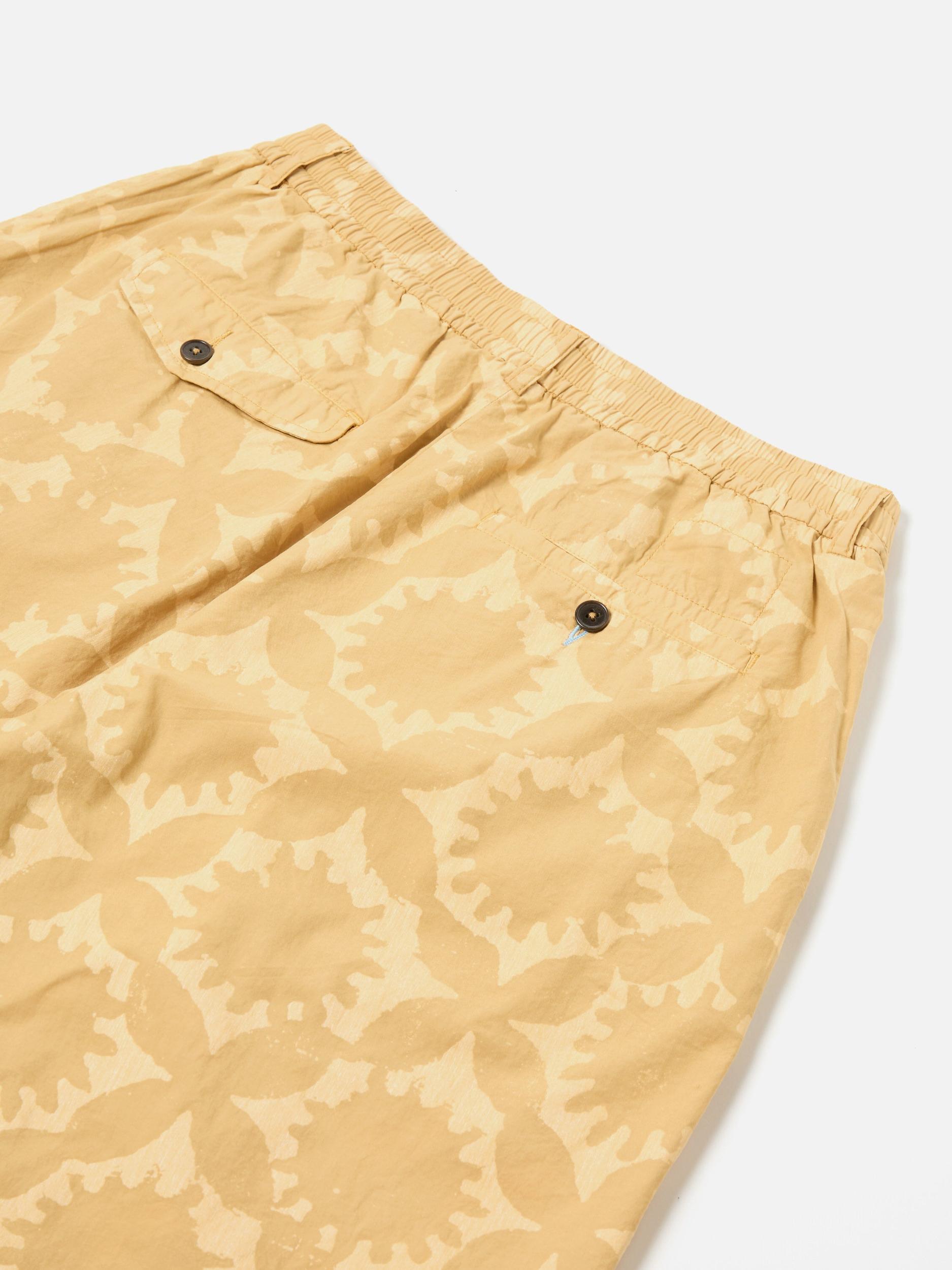 Universal Works Pleated Track Short in Sand Over Dyed Sun Print Product Image